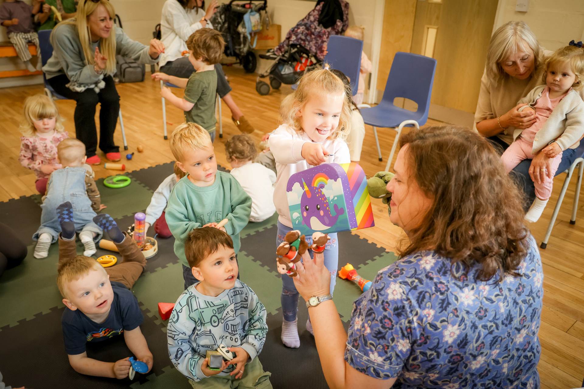 Mini Voices 2025 Mini Voices group of children with music teacher